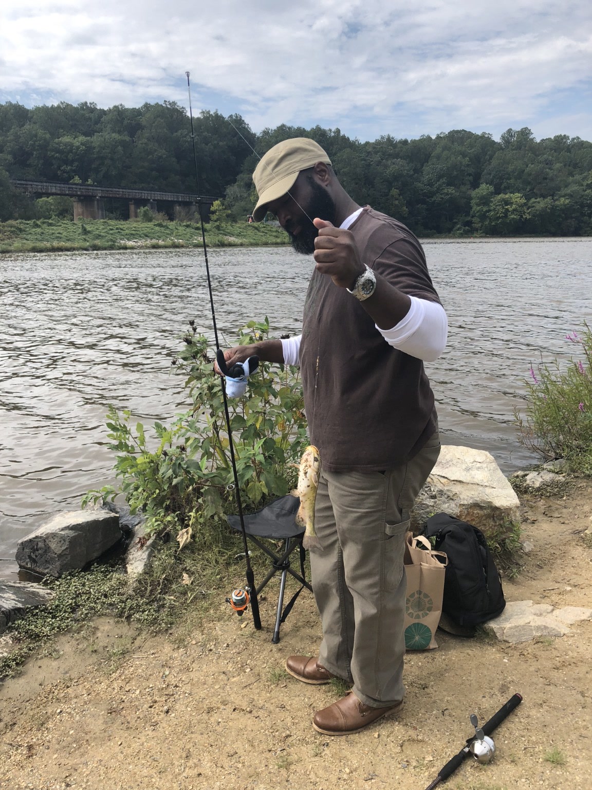 William Storm fishing beside a Maryland river